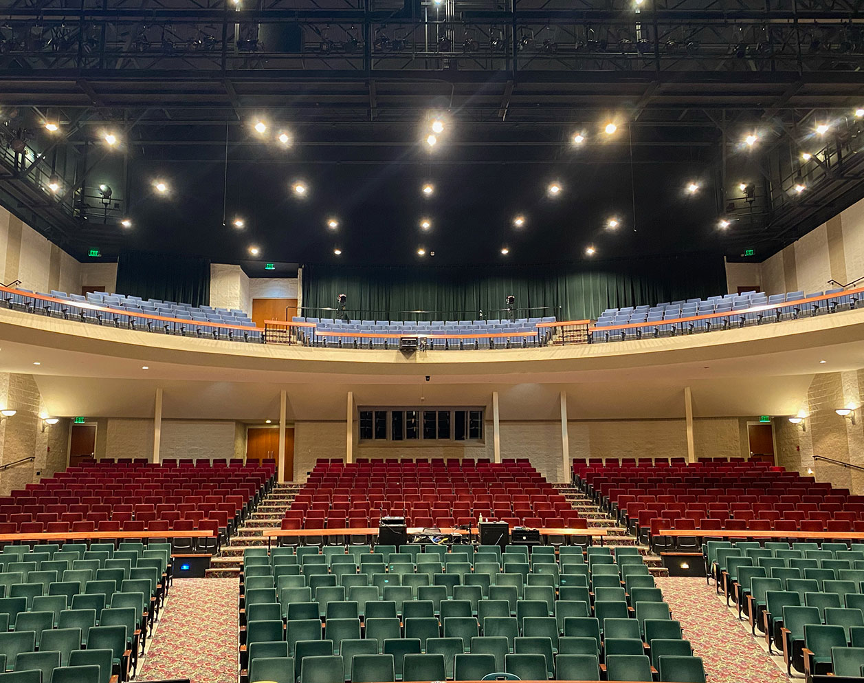 Paw Paw High School auditorium after the RETRO LED retrofit, with house lights visible above the seating area