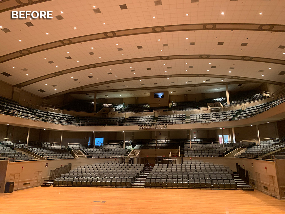 Township Auditorium before installation, with dim architectural lighting over the seating bowl