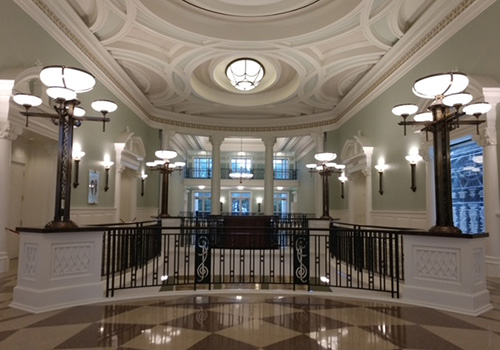 Charleston Gaillard Center lobby with decorative ceiling lights and railing