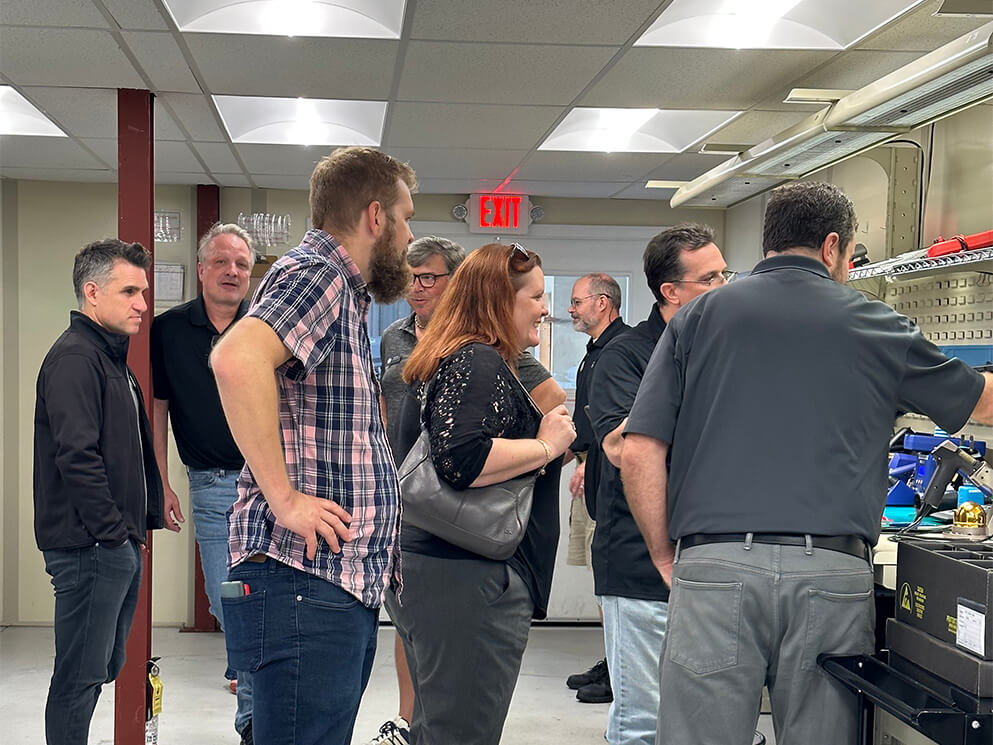 Representatives speaking with Canto USA staff on the factory floor